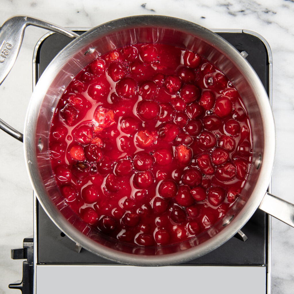 a pot of Cherry Filling simmering on the stove
