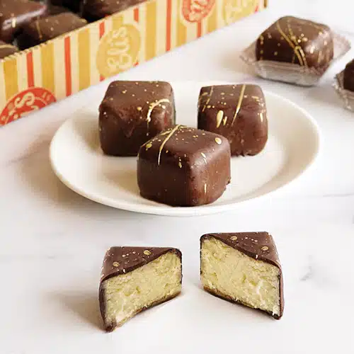 Bite-sized pieces of chocolate-covered cheesecakes