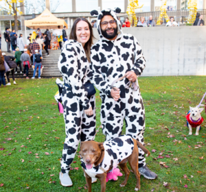 A dog and his humans dressed up for Halloween