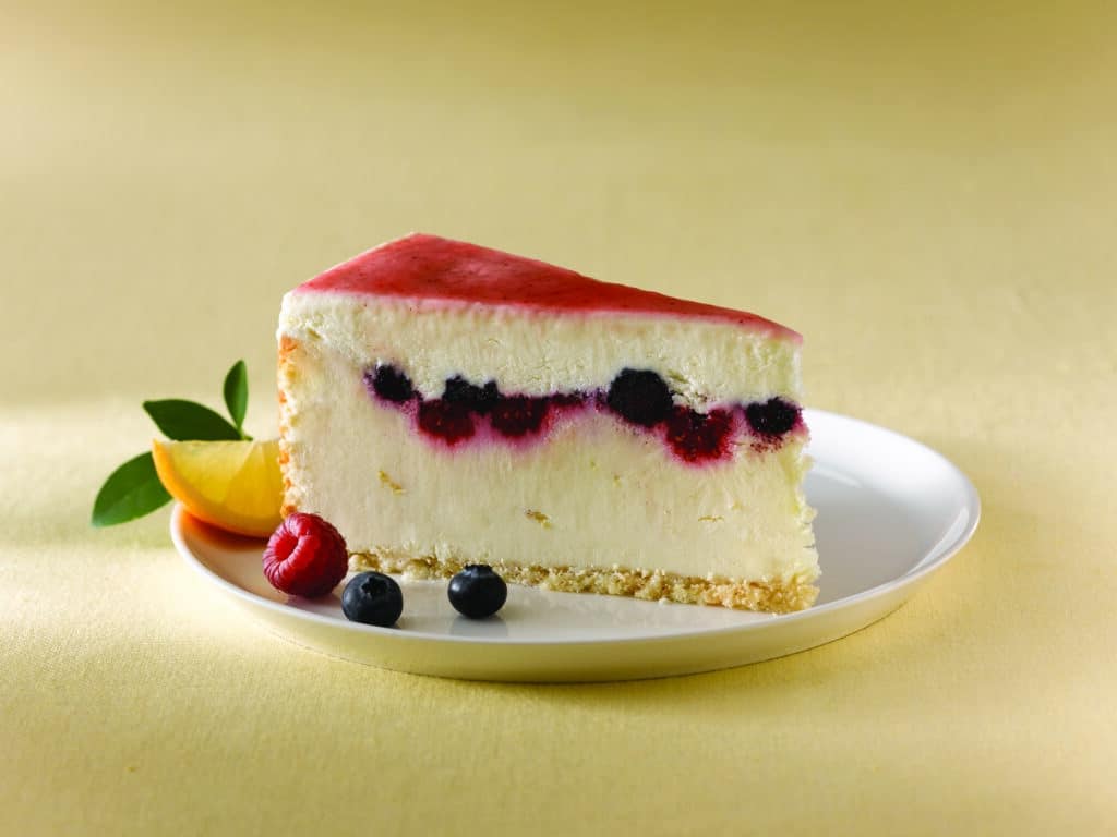 A slice of Lemon Mixed Berry Cheesecake