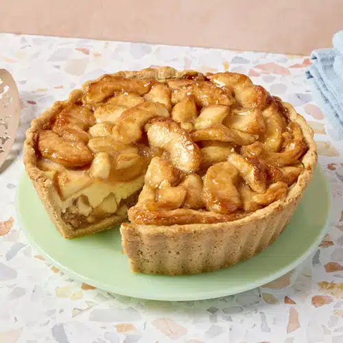 An apple tart on a green plate