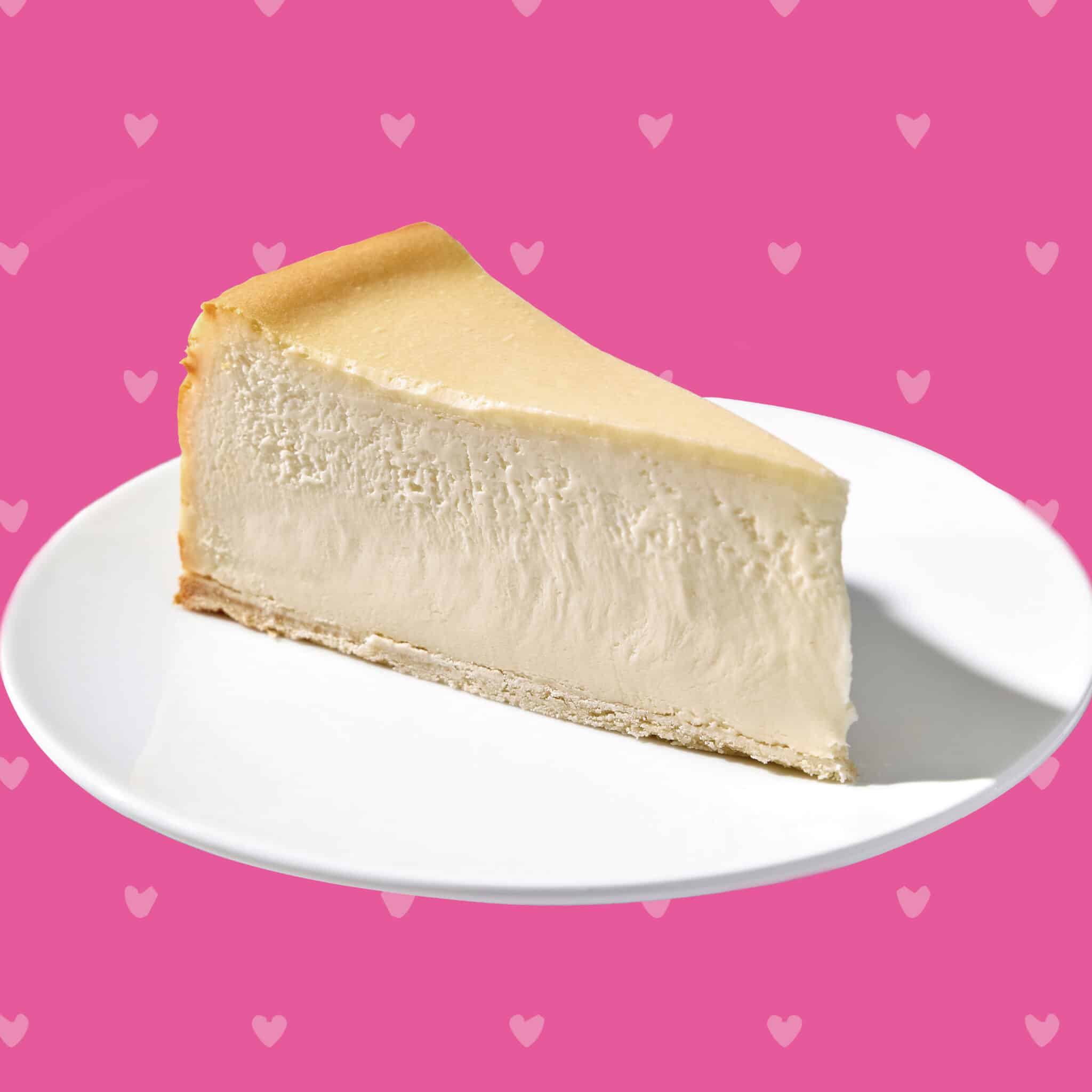 A slice of Original Plain cheesecake with a Valentine's Day background